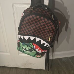 Sprayground Brown Checkered Backpack with Green Graphic